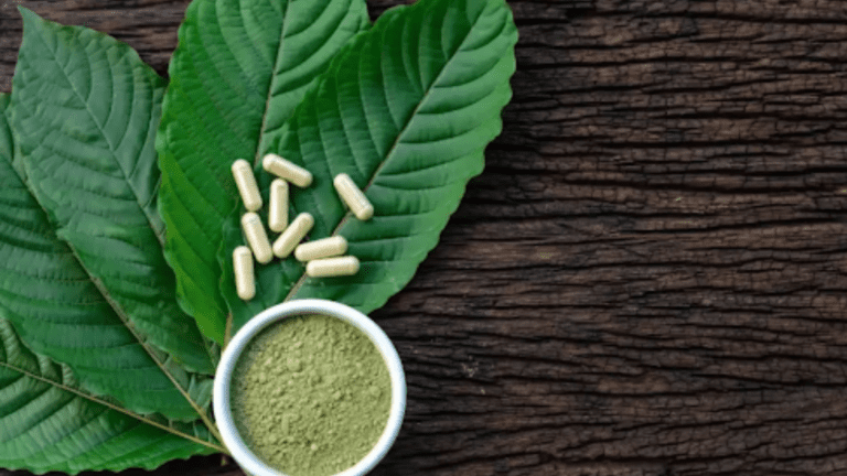 Kratom leaves, pills, and powder displayed together, representing the various forms of kratom