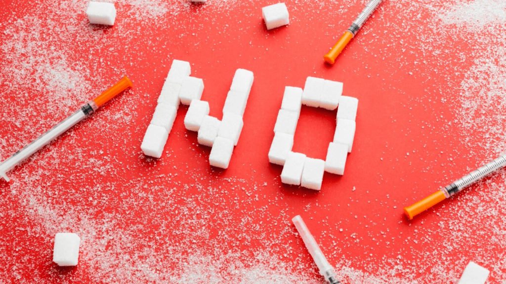 Crystal particles representing meth alongside syringes as paraphernalia for using fentanyl, an image symbolizing a strong message of avoidance due to the dangers of mixing meth and fentanyl.