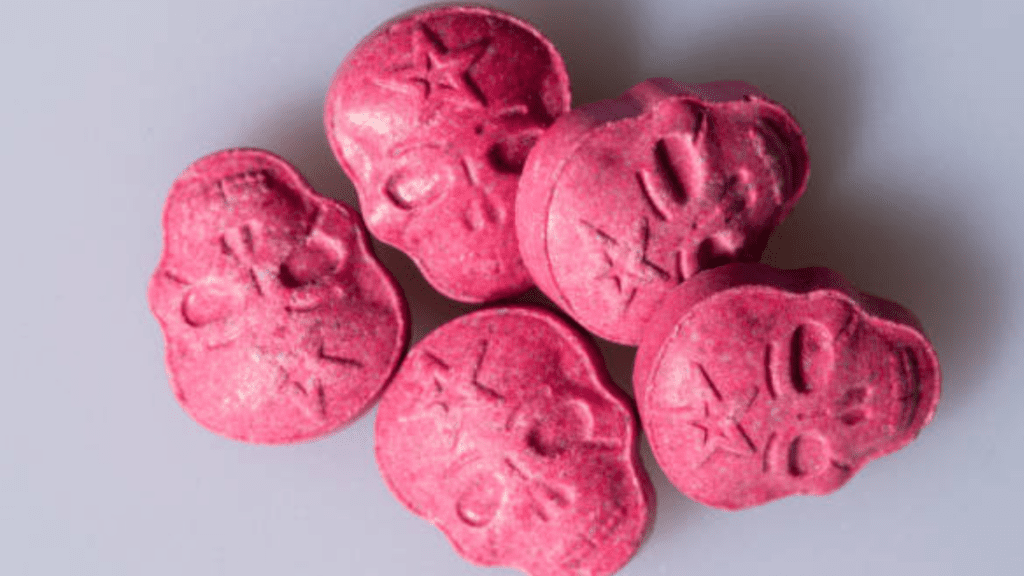 An image of skull-shaped ecstasy pills, showing the dangers that come with ecstasy addiction.