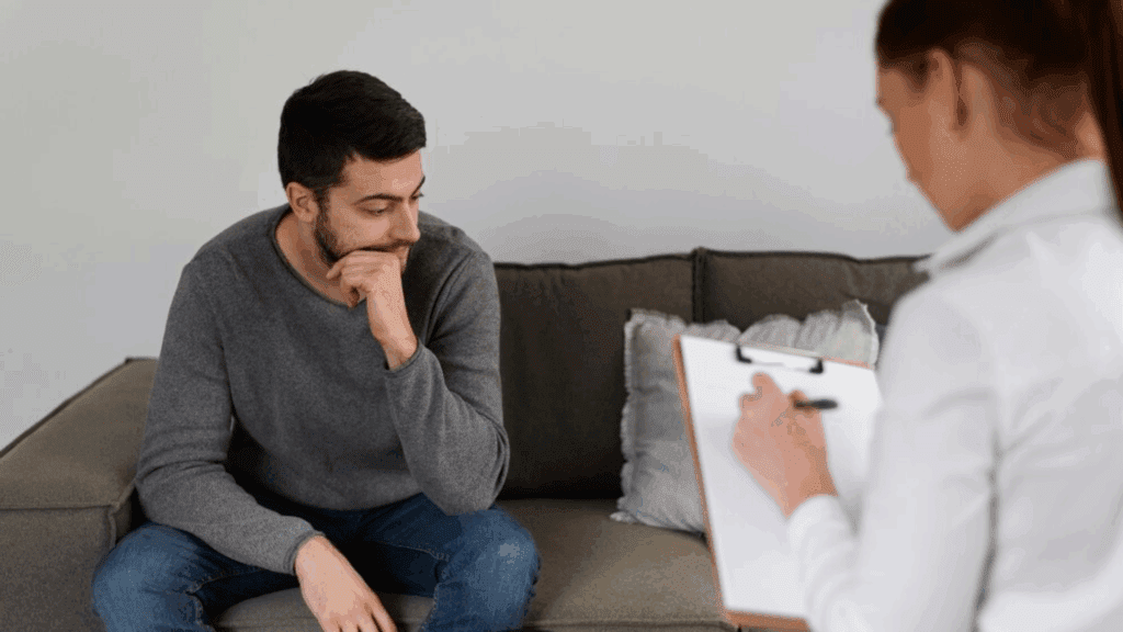 An image of a therapist and a gay person while in detox in an inpatient detox facility.