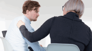 A lady convincing a gay person to go to rehab for drug intervention.