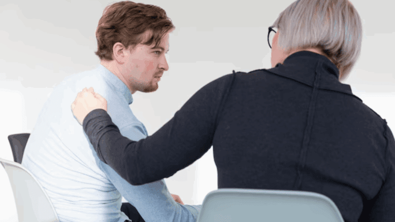 A lady convincing a gay person to go to rehab for drug intervention.