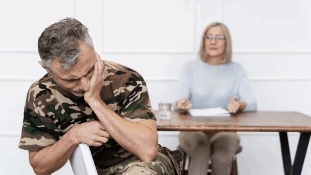 A therapist and a gay veteran seemingly experiencing PTSD episodes during therapy.