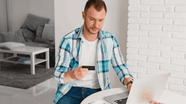 A gay man examining his insurance card.