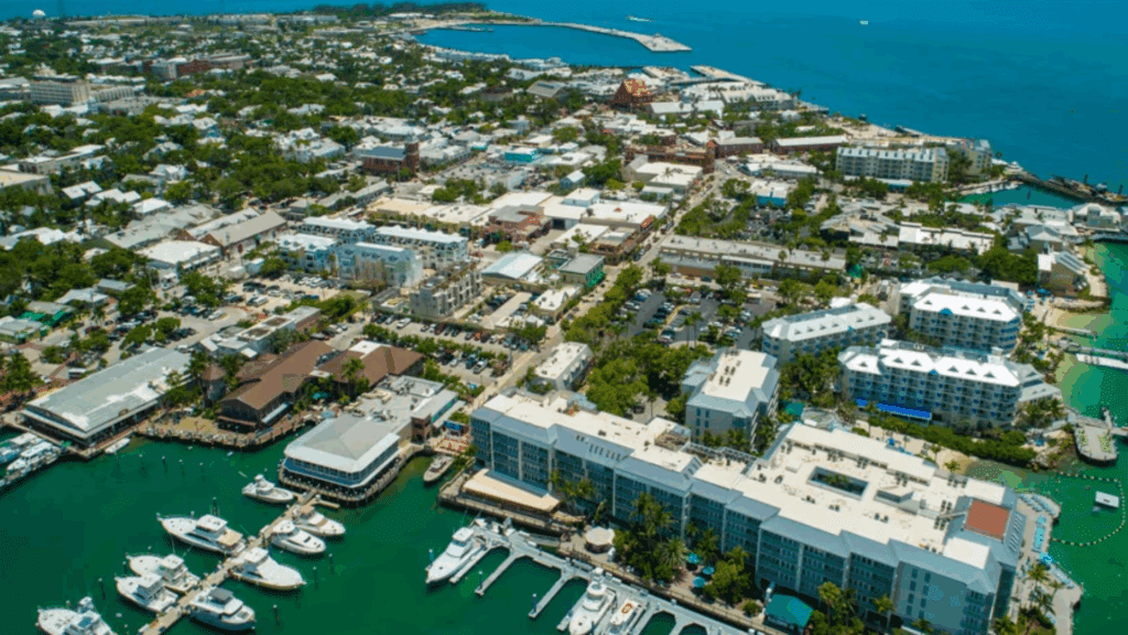 Aerial view of Key West, Florida, showcasing a vibrant coastal town with marinas, boats, and tropical architecture.