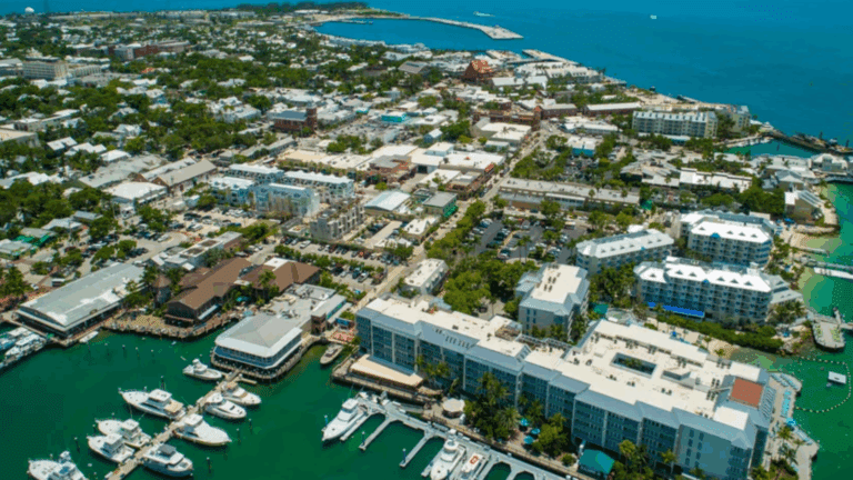 Aerial view of Key West, Florida, showcasing a vibrant coastal town with marinas, boats, and tropical architecture.