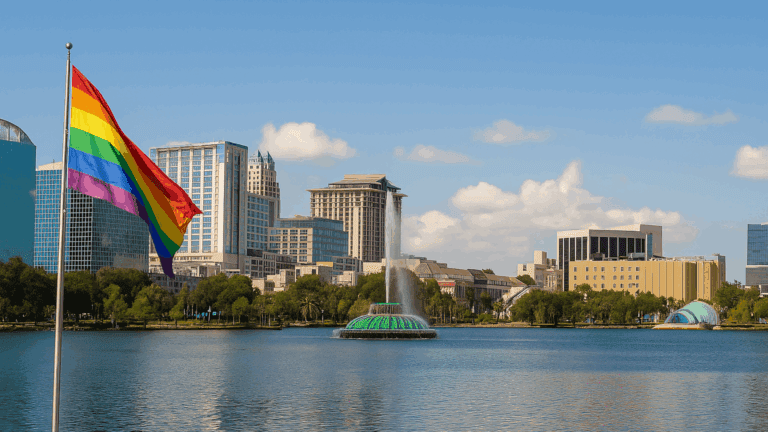 Rainbow pride flag near Lake Eola with the Orlando skyline in the background, representing LGBTQ detox services near Orlando Florida.