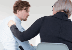 A lady convincing a gay person to go to rehab for drug intervention.