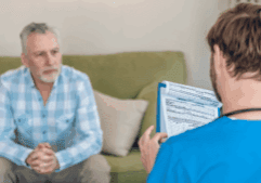 A gay person and a drug rehab nurse in an intake for alcohol withdrwawal.